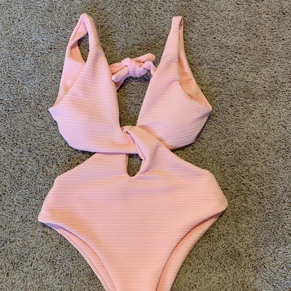 Pink one piece bathing suit.